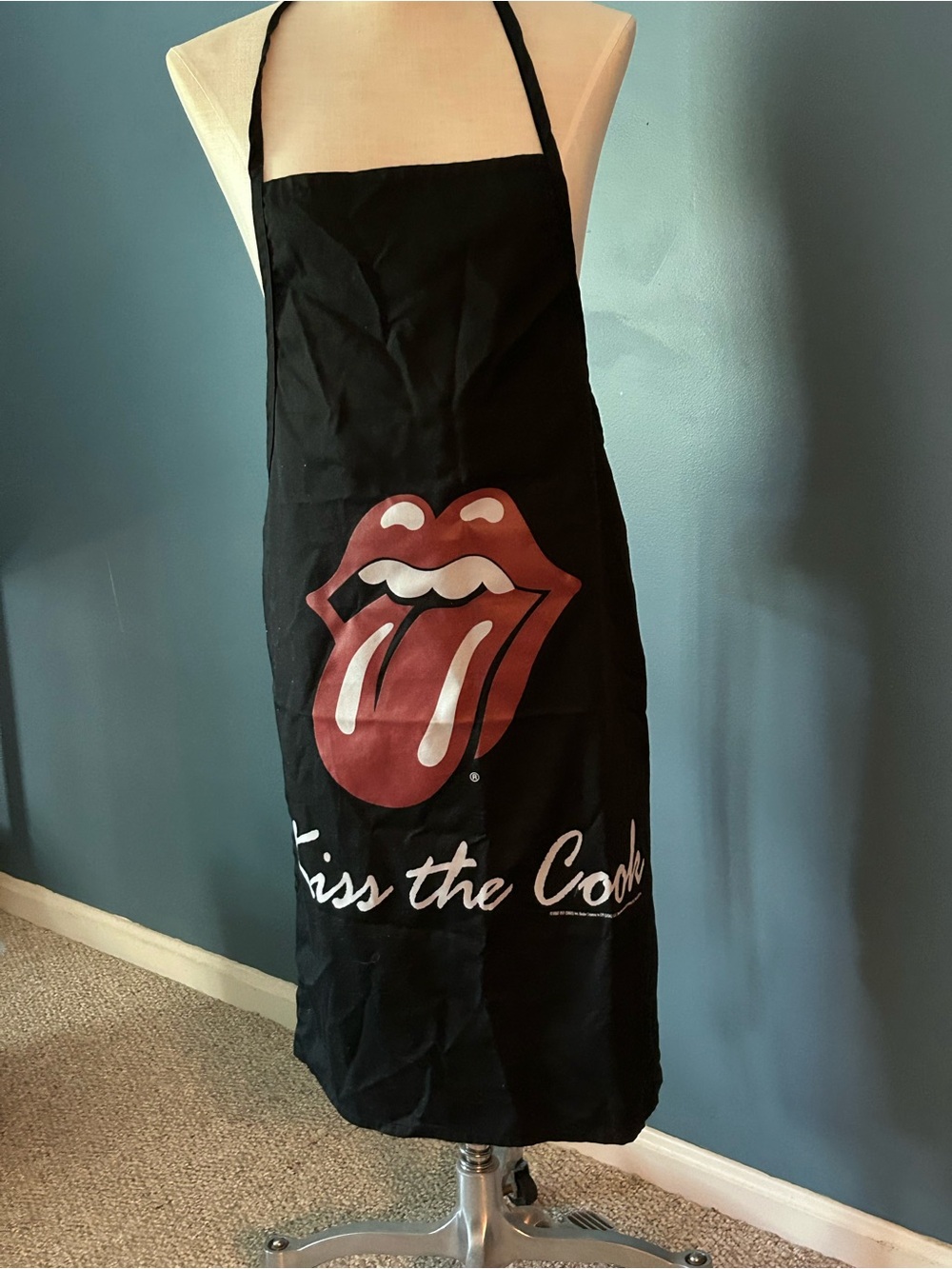 the Rolling Stones Black Apron with Red Tongue Graphic